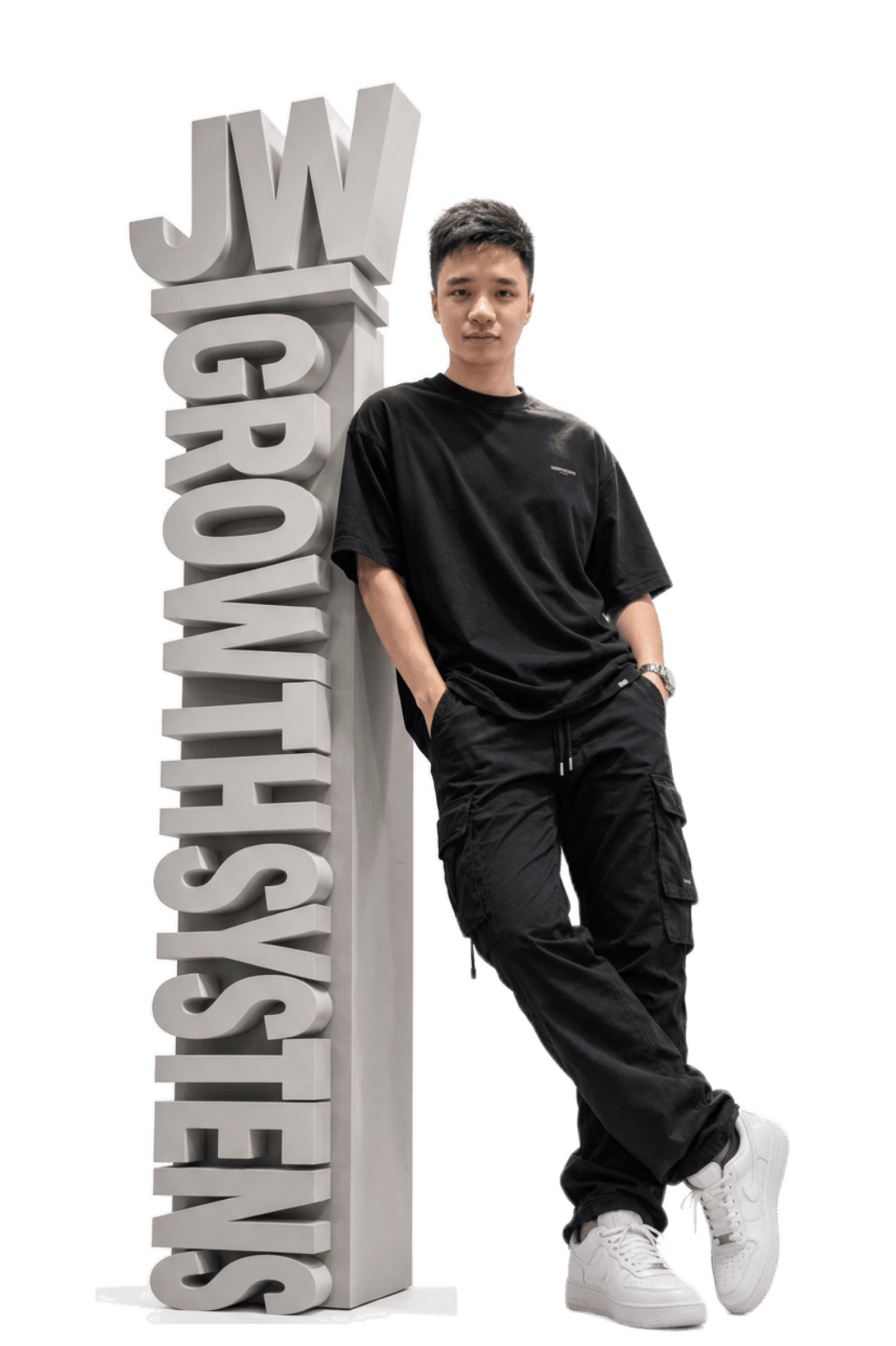 Jun-Wei beside the JW Growth Systems sign